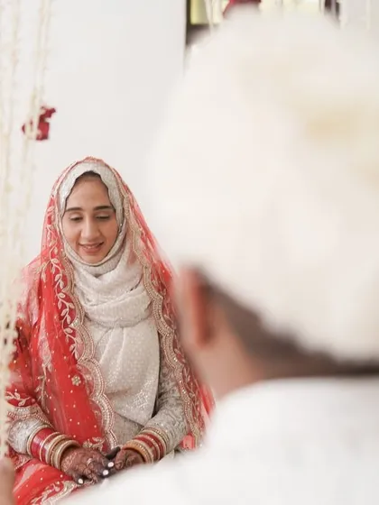 A quiet, respectful moment during the Nikkah ceremony. This photo captures the bride's serene demeanor as she listens to the proceedings, embodying the grace of the occasion.