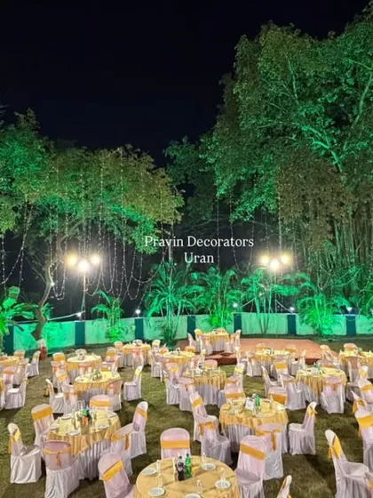 We also do decor for other events, not just weddings. This was a large outdoor setup we did for a New Year's party, with extensive seating and dramatic green lighting on the trees.