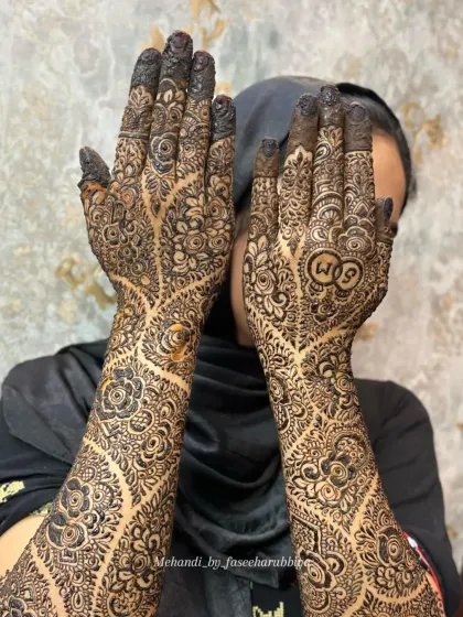 Another angle of this unique engagement henna, showing the delicate vine work that covers both arms.