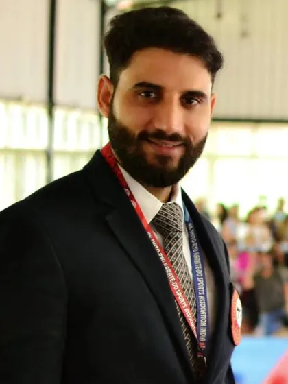A portrait of me, Shihan Ashish Kumar. As the founder and coach, I am personally invested in every student's growth, guiding them to become not just skilled martial artists but also confident individuals.