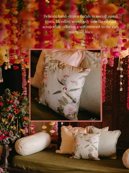 A close-up of the hand-drawn floral cushions used at my home Mehndi. The delicate pastel tones provided a soft contrast to the vibrant marigold decor, blending seamlessly into the setup.
