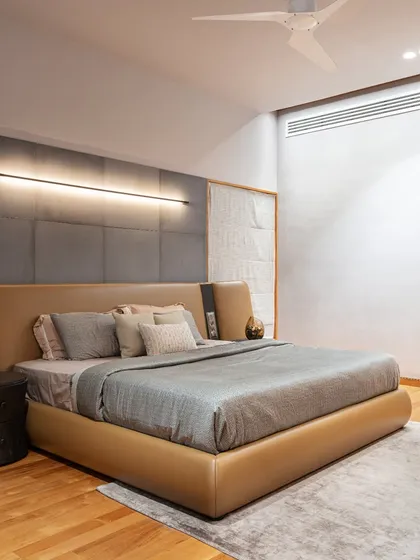 This master bedroom in the Faizal Residence balances luxury and comfort. We used a custom leather and fabric headboard, sleek linear lighting, and a mix of soft textures to create a restful and sophisticated retreat.