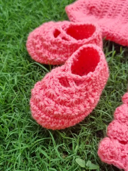 Look at these tiny, handmade baby booties. I pay close attention to detail to make sure every piece is perfect and safe for a baby.