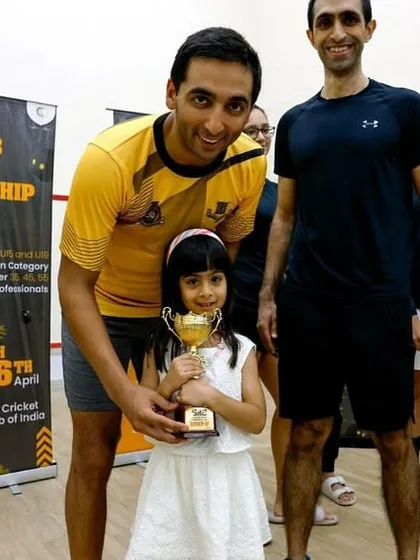 It's more than just a game. A proud father shares a moment of victory with his daughter, capturing the family-friendly and community spirit of our events.