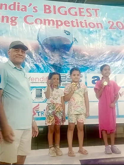 Celebrating our little mermaid, Flanshi, on the podium after winning a bronze medal at the Delhi Open Search Swimming Competition at Talkatora stadium.