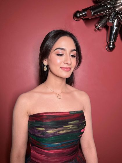 A close-up on the beauty of minimal makeup. Softly defined eyes and a natural lip colour create a look that is effortlessly stunning and lets your confidence shine.