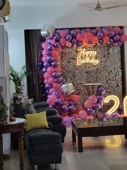The full living room view of the pink and purple 26th birthday celebration.