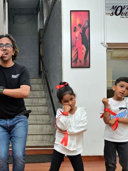 Our instructor and two young students striking a pose. We encourage individuality and self-expression in all our classes.