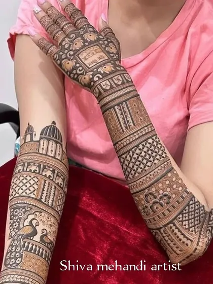This design features a prominent architectural dome, reminiscent of a palace or temple, surrounded by peacocks and intricate check patterns.