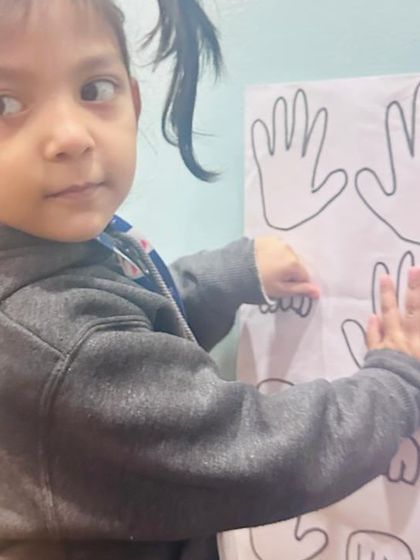 A student participates in a hands-on matching game. We use screen-free activities to develop cognitive skills and encourage tactile learning.