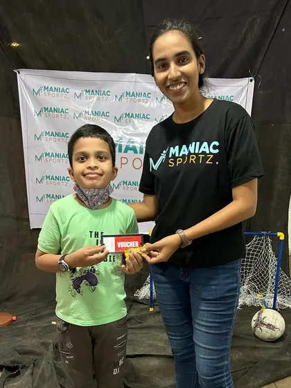 A young participant wins a voucher at our booth during the RABA Foundation event. We love engaging with the community.