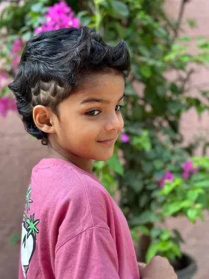 A great shot of this happy client showing off his Spidey-inspired haircut.