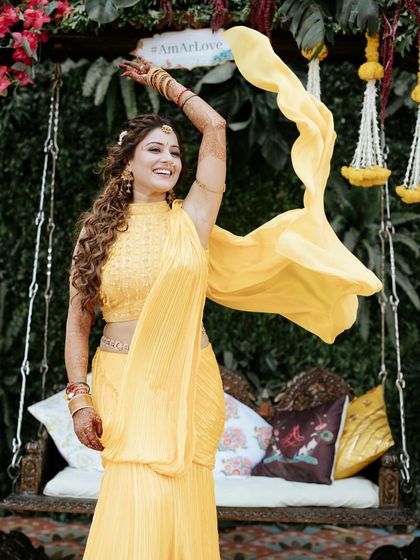 The bride's joyful twirl, her yellow outfit flowing beautifully. We create the perfect setting for our brides to feel like the main character.
