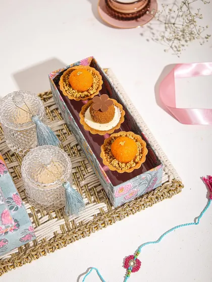 Our Mithai Tartlets displayed as part of a festive hamper, perfect for Rakhi or Diwali.
