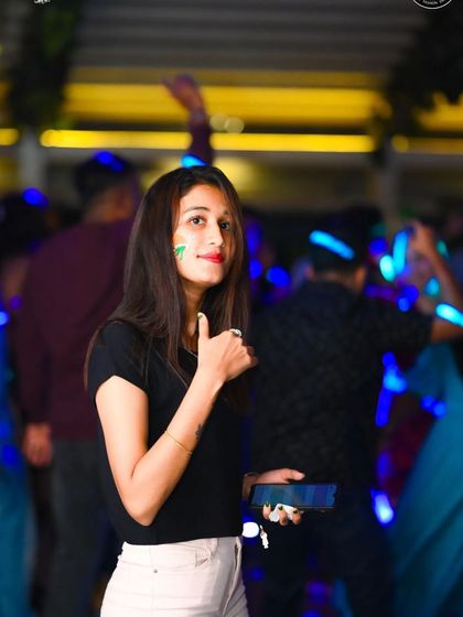 A guest giving a thumbs-up from the dance floor. This is the feedback I look for all night long.