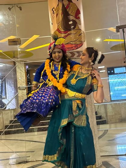 My little 'Natkhat Kanha' in action! This playful image captures the mischievous spirit of Lord Krishna as he is being carried by Yashoda.