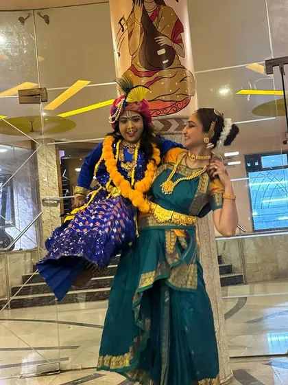 My little 'Natkhat Kanha' in action! This playful image captures the mischievous spirit of Lord Krishna as he is being carried by Yashoda.