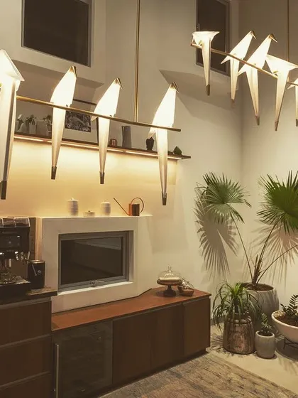 Breakout areas and pantries are key parts of office life. Here, a combination of whimsical decorative fixtures and practical under-shelf joinery lighting creates a space that is both a joy to be in and perfectly functional.