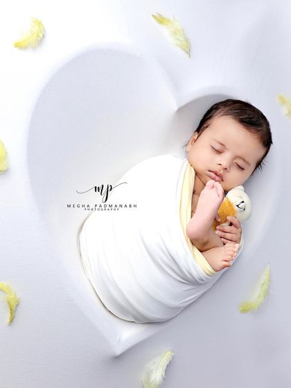 A different angle of this adorable duo, capturing a moment of pure innocence.