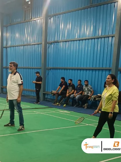 Spectators and players enjoying the atmosphere at our indoor badminton facility. I ensure there's a comfortable and engaging environment for everyone involved.