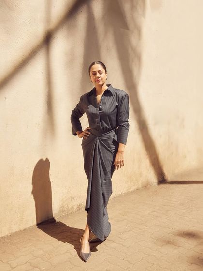 The full look in color, highlighting the asymmetrical hem and the elegant knot detail at the waist.