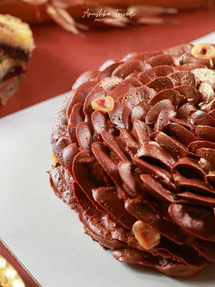 A close-up detail shot of the chocolate petal cake. This macro view allows you to appreciate the skill and artistry that went into decorating it.