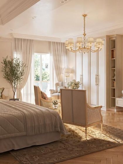 An expression of timeless elegance, this spacious bedroom is designed as a complete suite. It includes a comfortable seating area, custom built-in wardrobes, and beautiful herringbone wood floors, all in a serene, neutral palette.