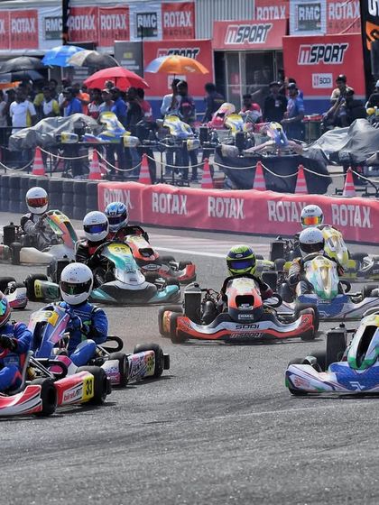 A pack of karts jostles for position at the start of a race. We manage every aspect of the race, from the starting procedure to the final lap.