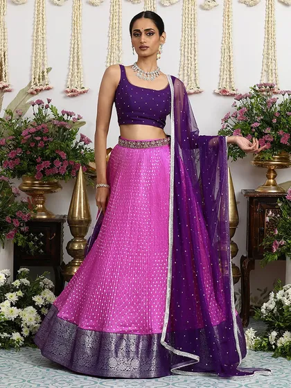 Another view of this stunning lehenga, highlighting the contrast between the pink Bandhani skirt and the purple brocade border.