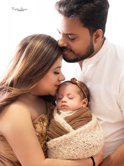 Capturing the connection between parents and their new baby is so important. This intimate portrait shows a tender moment, preserving the love and emotion of these first few days together.