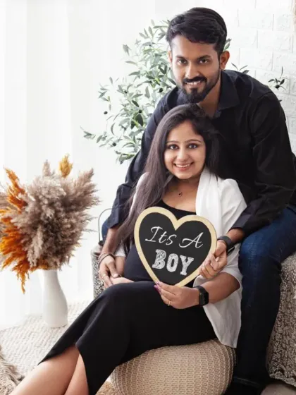 The parents-to-be are all smiles announcing they're having a boy. This photo in my boho setup is a wonderful way to share the news with family and friends.