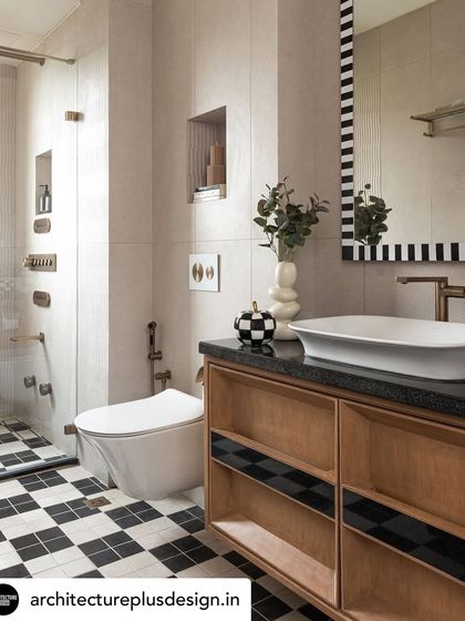Our detail-oriented approach to bathrooms, like this one with its bold checkered floor and custom vanity, was highlighted in this magazine feature. It shows that even functional spaces can be designed with personality and style.