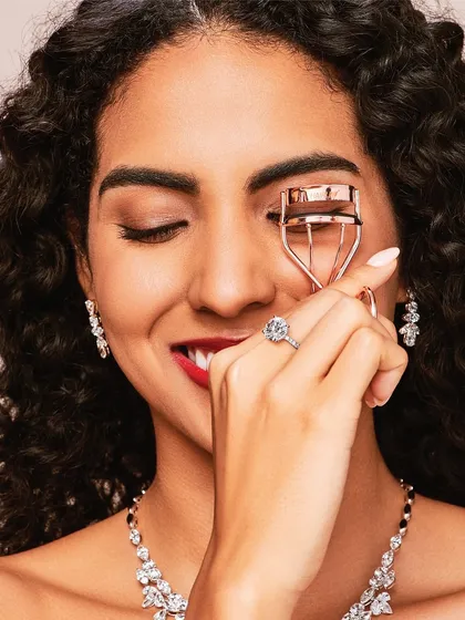A playful and bright beauty shot for Aukera Jewellery. I used a classic winged eyeliner and a vibrant red lipstick to create a timeless look that highlights the model's smile and the intricate jewellery.