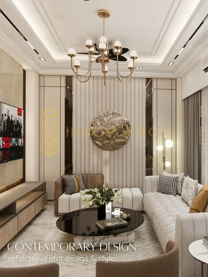 This living room at Akansha Enclave, Ghaziabad, is a perfect example of my contemporary design style. I've used a neutral palette with fluted wall panels, metallic accents, and a statement chandelier to create a space that feels both opulent and welcoming.