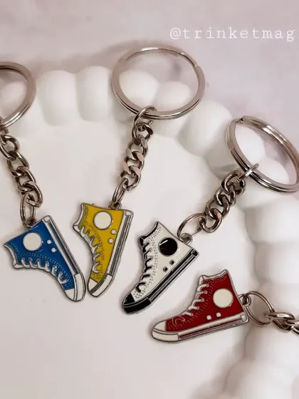 Gifts for the goal-getters. These sporty keychains feature colorful sneaker charms, perfect for any soccer or sneaker fan.
