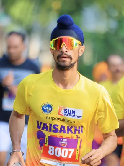 Competing in the Super Sikh Run marathon. Endurance is a critical component of overall fitness, and I practice what I preach by pushing my own limits in different athletic disciplines.