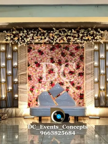 Another view of the elegant Sangeet decor, showing the beautiful texture of the flower wall and the soft glow from the integrated lighting.