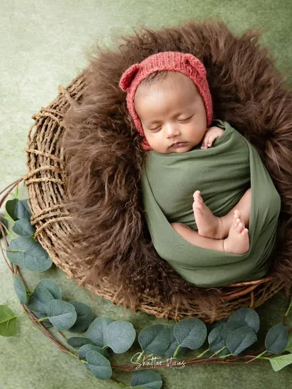 A top-down view of the nest-like setup, with eucalyptus leaves adding a natural, rustic element.