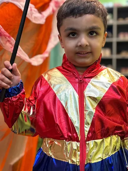 The same little superhero posing with his magic wand, ready to save the day.