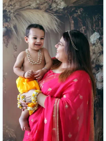 The shared laughter between a mother and her son makes this Krishna-themed portrait truly special. We love including family in our sessions.