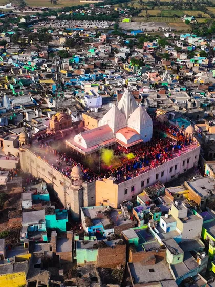 The Nandgaon temple surrounded by the colorful houses of the town. The entire community comes together for this festival.