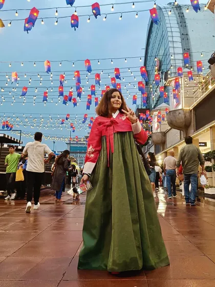 Attending and promoting cultural events is a key part of what I do. Here I am at the Korean Street Fair in a traditional Hanbok, an experience I shared with my followers to generate excitement and engagement for the event organizers.
