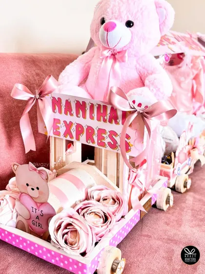 The 'Nanihaal Express' engine carriage, led by a big pink teddy bear and decorated with artificial roses. The details make this trousseau truly special.