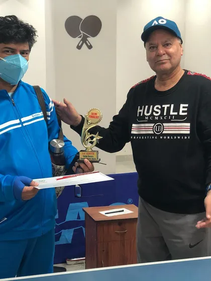 Presenting one of our third-place winners with his trophy and certificate. In our tournaments, we recognize multiple top spots to honor the high level of competition.