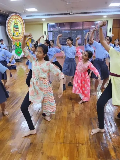 The energy in the room is palpable as these young dancers practice their routine. We encourage them to express themselves fully through the dance.
