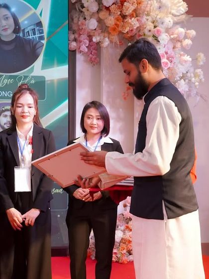 Awarding a certificate to a graduate of a teacher training program in Vietnam. It is a proud moment to see new teachers equipped with authentic knowledge, ready to share the gift of yoga with their communities.