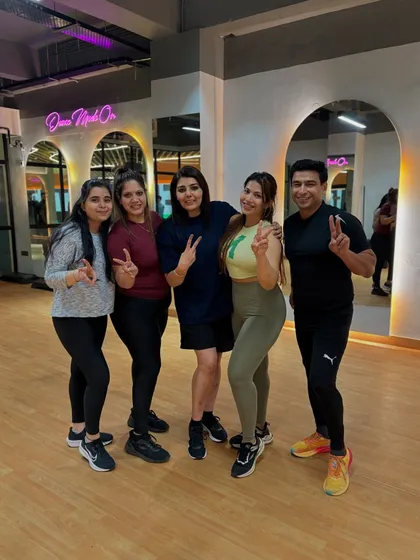 Posing with my clients after a great workout. Seeing their progress and smiles is the best reward.