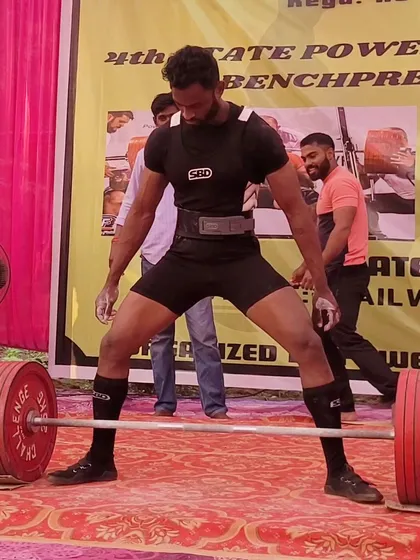 An athlete setting up for a deadlift at the State Meet. The platform is where all the training is put to the test.