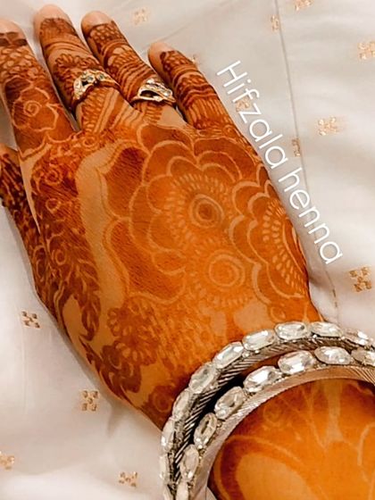Jaadu. The magic of a perfect henna stain, adorned with a simple silver bangle.