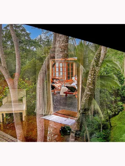 An early work from my archives, this image from Bali captures the serene indoor life of a resort reflected against the lush jungle outside. It's a study in layering environments to create a single, cohesive story.